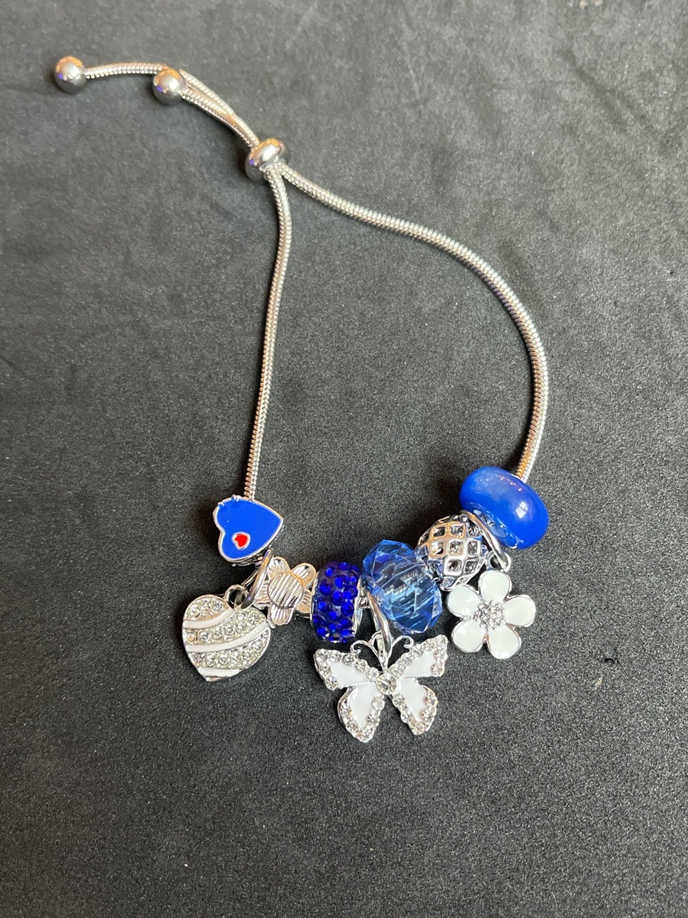 Sterling Silver Blue Charm Slide Bracelet with Butterfly & Flower Charms
